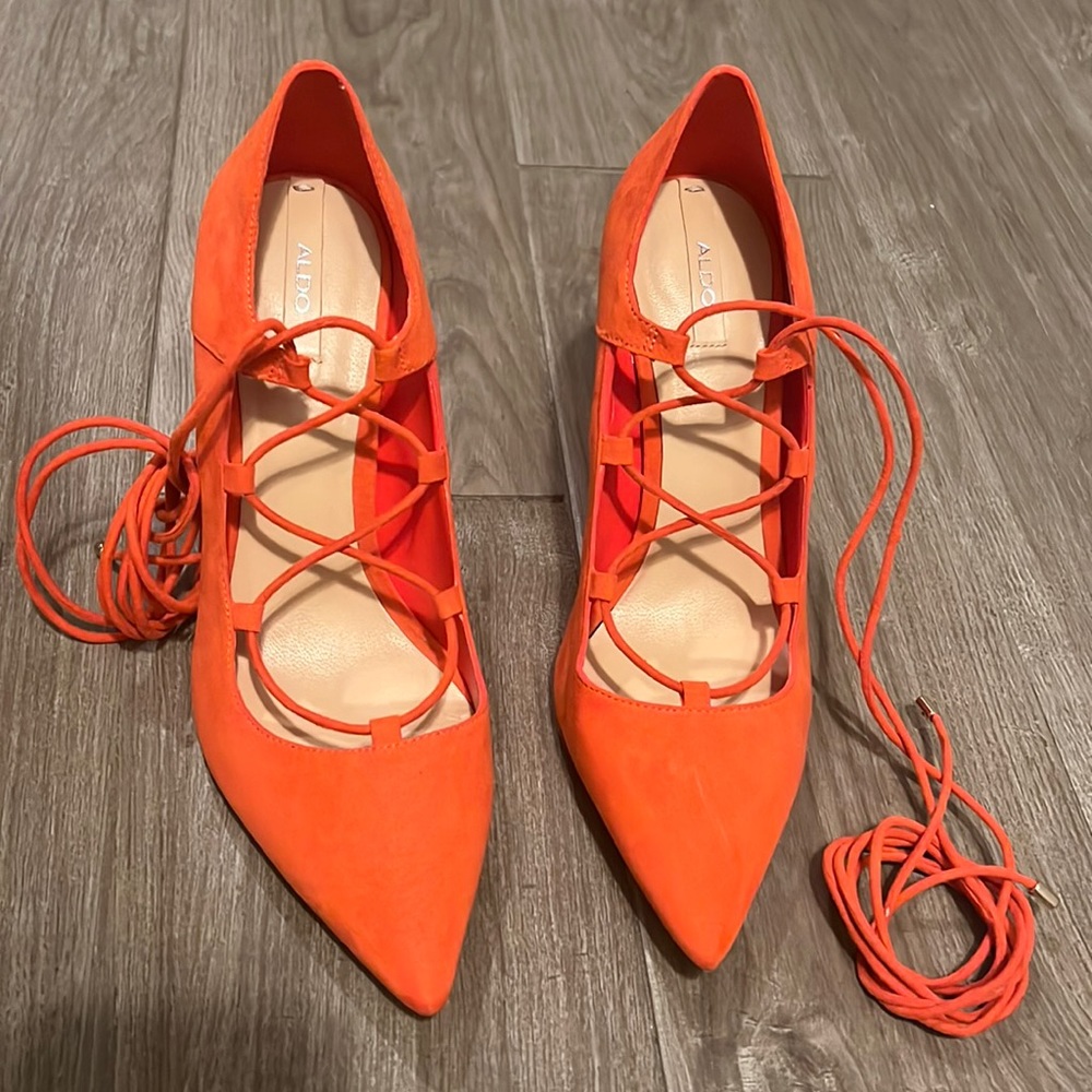 Beautiful orange pointed heels, size 7.5 us, with laces, ALDO brand.